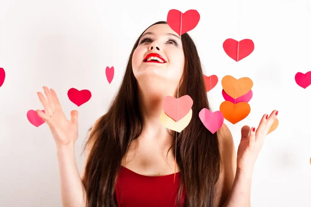 A woman with her hands up in the air